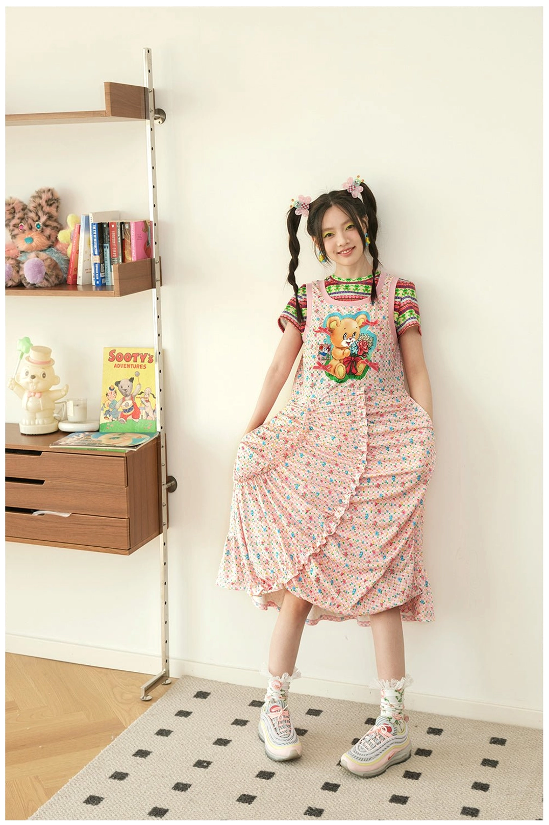 Pink floral teddy bear pinafore midi dress with ruched front detail, side pockets, and overall style straps