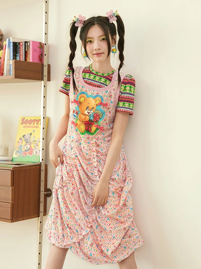 Pink teddy bear floral ruched pinafore midi dress styled with a striped short sleeve tee in a cozy indoor streetwear look