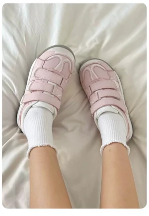 Pink Korean streetwear platform sneakers worn with white crew socks in an overhead casual outfit view
