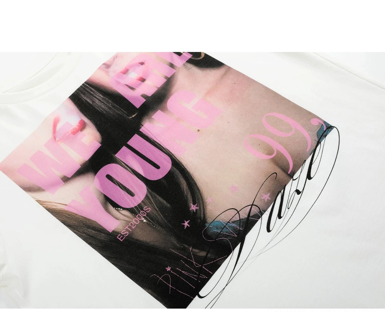 Close-up flat lay of pink We Are Young typography, portrait artwork, cursive lettering, star accents, and EST2000s detail