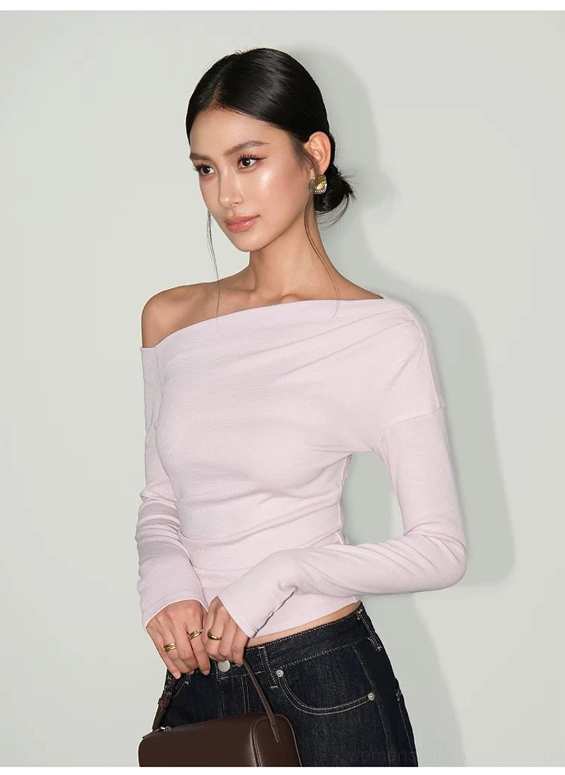 Pinkish purple slim tailored asymmetric one-shoulder streetwear tee styled with dark denim and a handbag