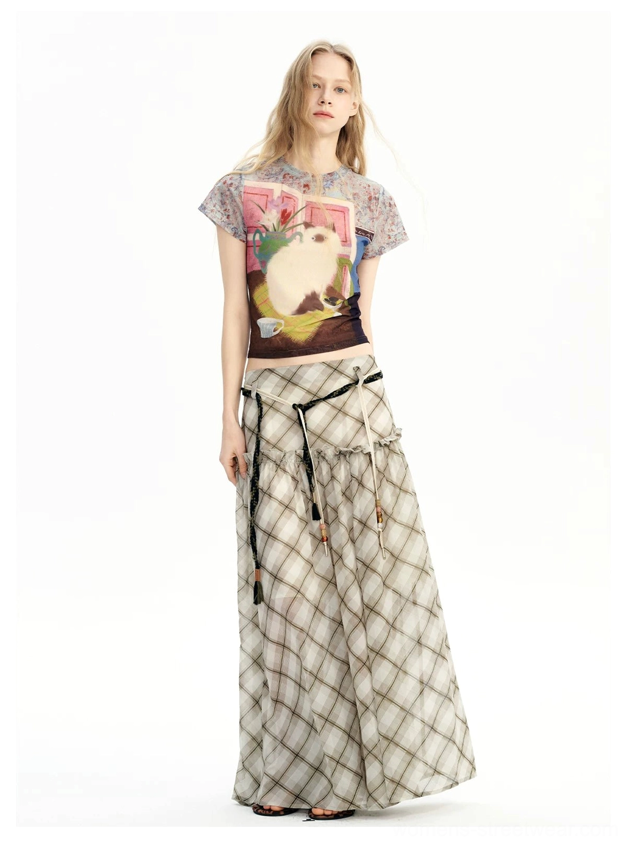 Full outfit featuring a neutral plaid chiffon maxi skirt, cropped graphic tee, and black slide sandals