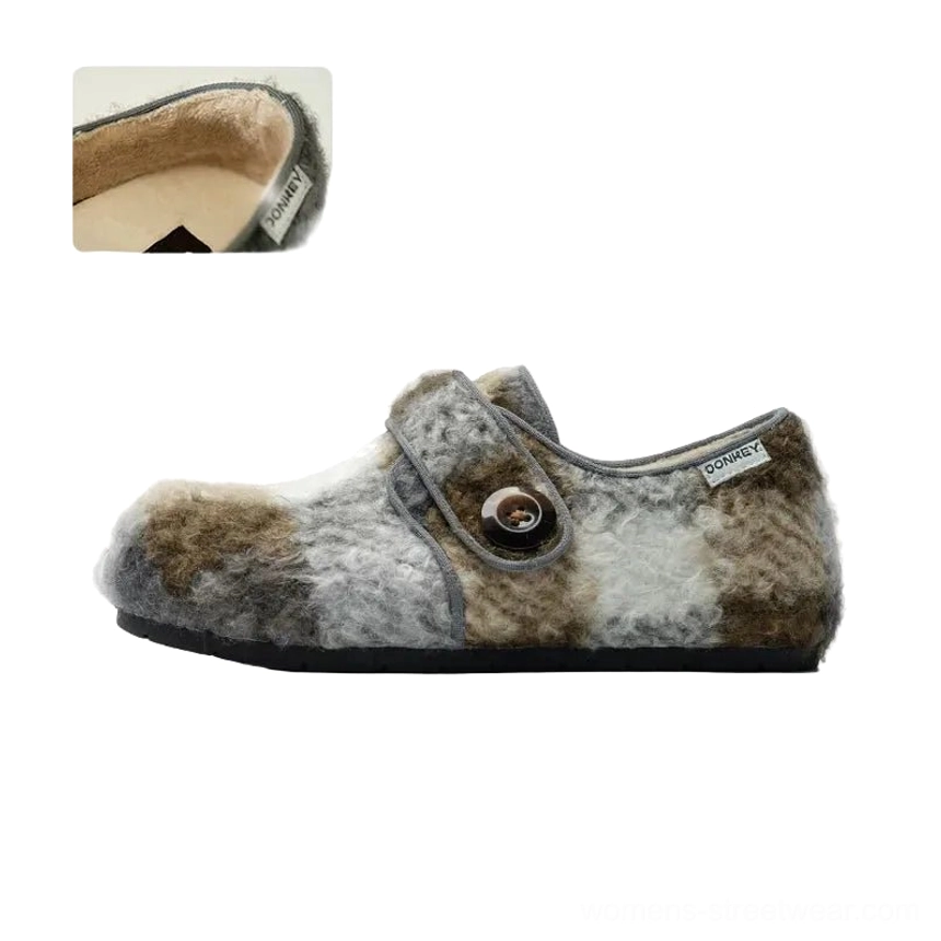 Plaid fuzzy fleece Mary Jane slippers featuring brown gray and white checked textile, decorative button strap, rounded toe, and casual rubber sole