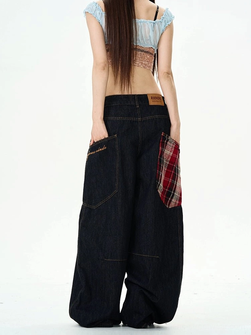 Three-quarter back view of plaid patch denim cargo pants with side cargo pocket, contrast stitching, and oversized wide legs