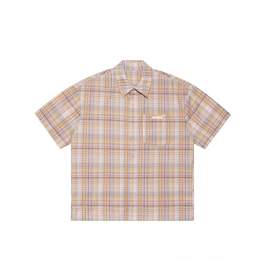 Plaid short sleeve button-down shirt image featuring a loose fit, embroidered detail, and modern East Asian streetwear style