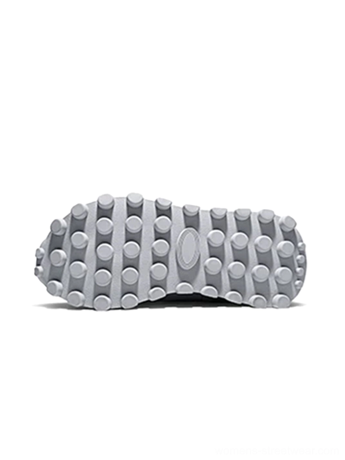 Overhead view of the thick platform outsole showing circular studded traction details on rugged streetwear shoes