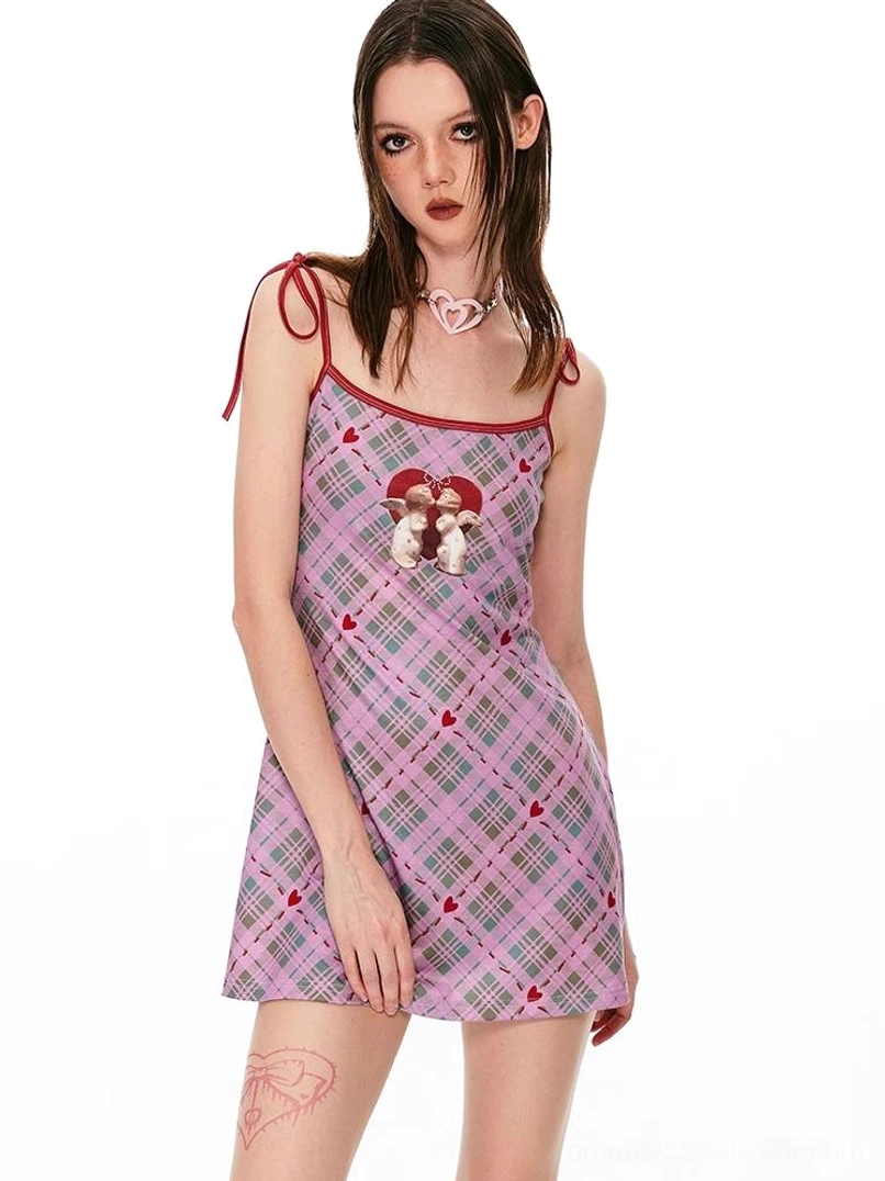 Playful gingham cami mini dress with angel motif, red neckline accents, and Y2K streetwear appeal