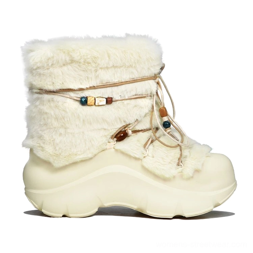 Close-up side view of a plush faux fur platform snow boot highlighting soft texture and decorative beaded lacing