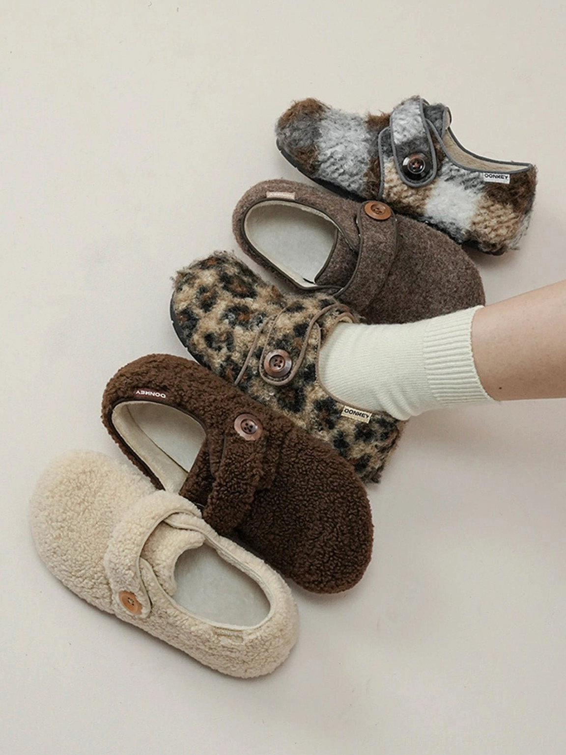 Plush leopard print Velcro slip-on footwear with rounded toe adjustable strap and soft casual streetwear construction