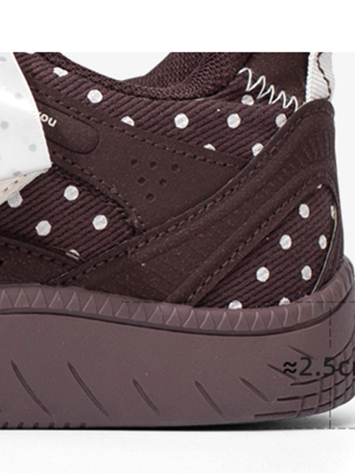 Polka dot ribbon sneakers with a padded collar, contrast overlays, and a versatile low top skate profile