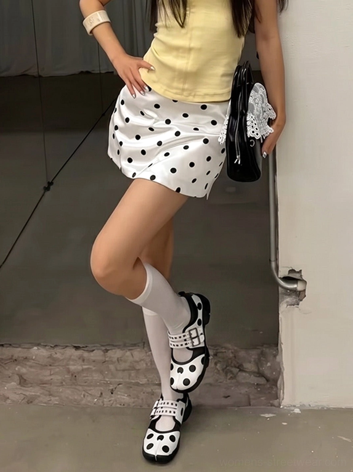 Y2K streetwear outfit featuring polka dot split-toe Mary Jane shoes with double buckle straps