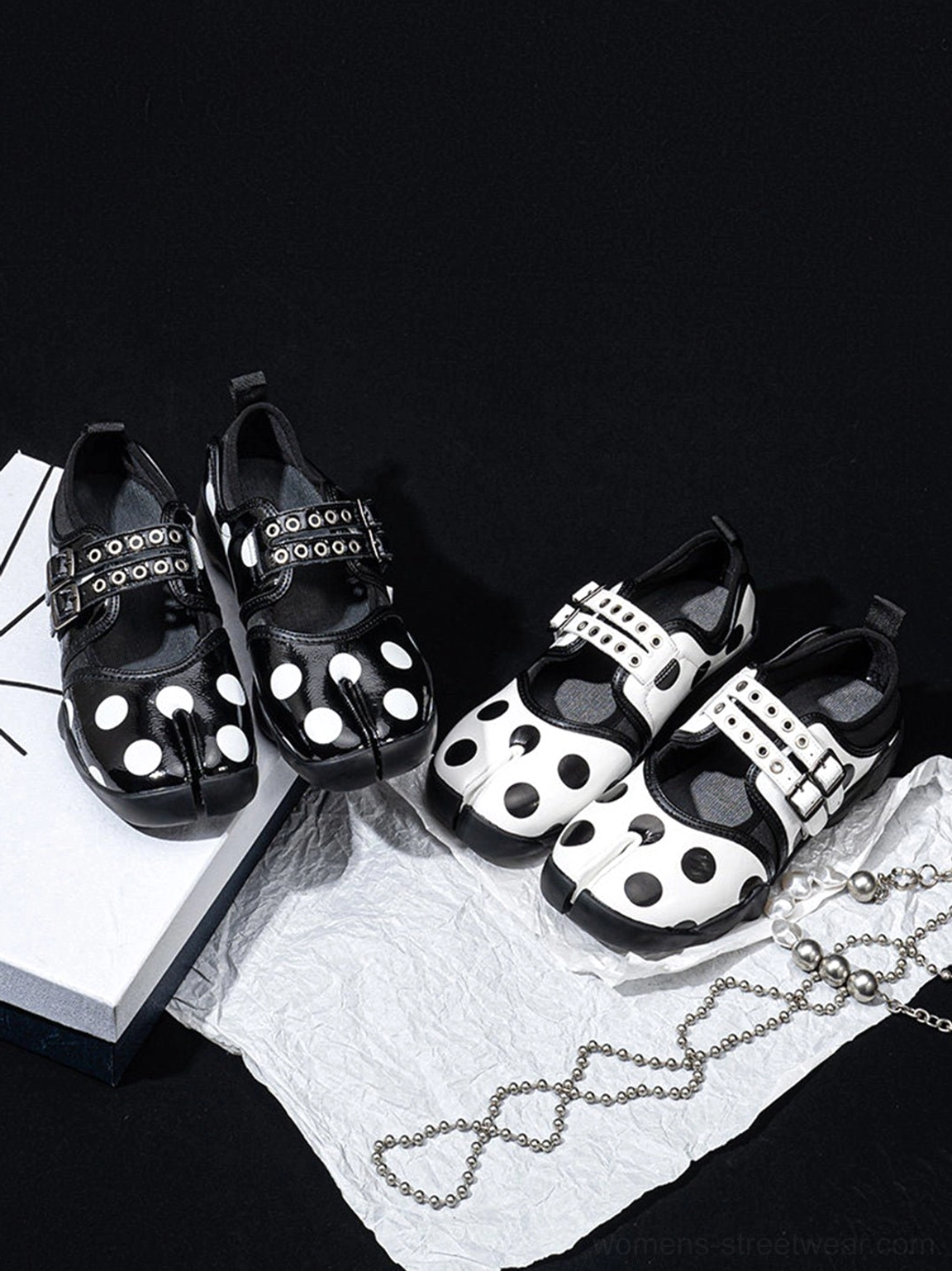 Two color variations of split-toe polka dot Mary Jane sneakers with double buckle straps