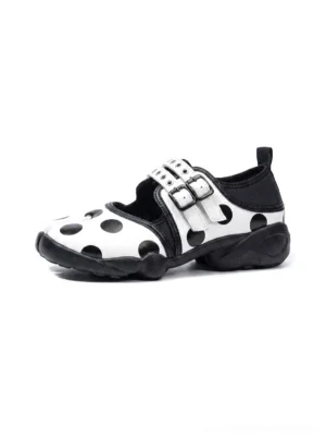 White polka dot split-toe Mary Jane sneakers with adjustable double buckle straps and chunky black rubber outsole