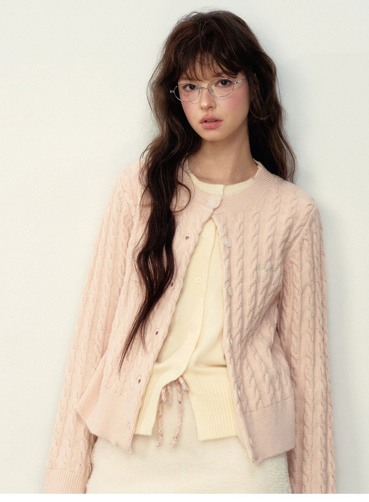 Preppy cable knit cardigan in college gray and milky pink for layered soft academia fashion looks