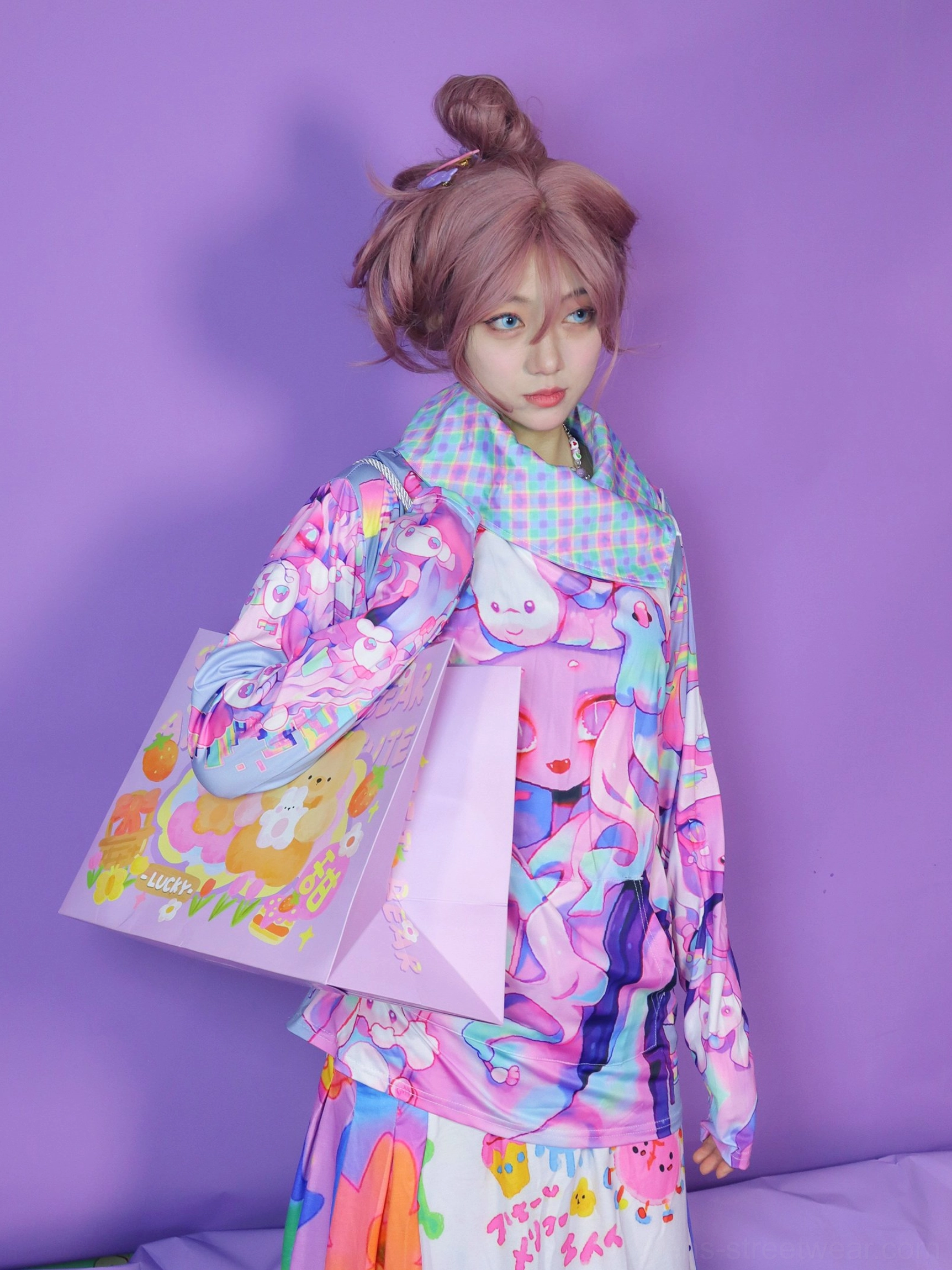 Three-quarter view of a vibrant psychedelic anime sweatshirt with checked mesh collar and coordinated kawaii streetwear outfit