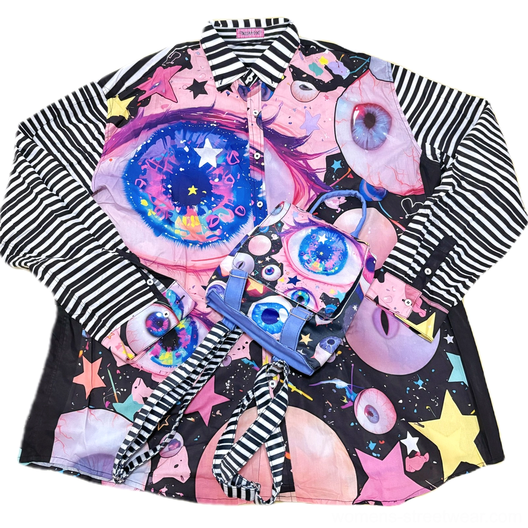 Flat lay of psychedelic cosmic eye striped sleeve oversized button shirt showing graphic print collar and relaxed silhouette