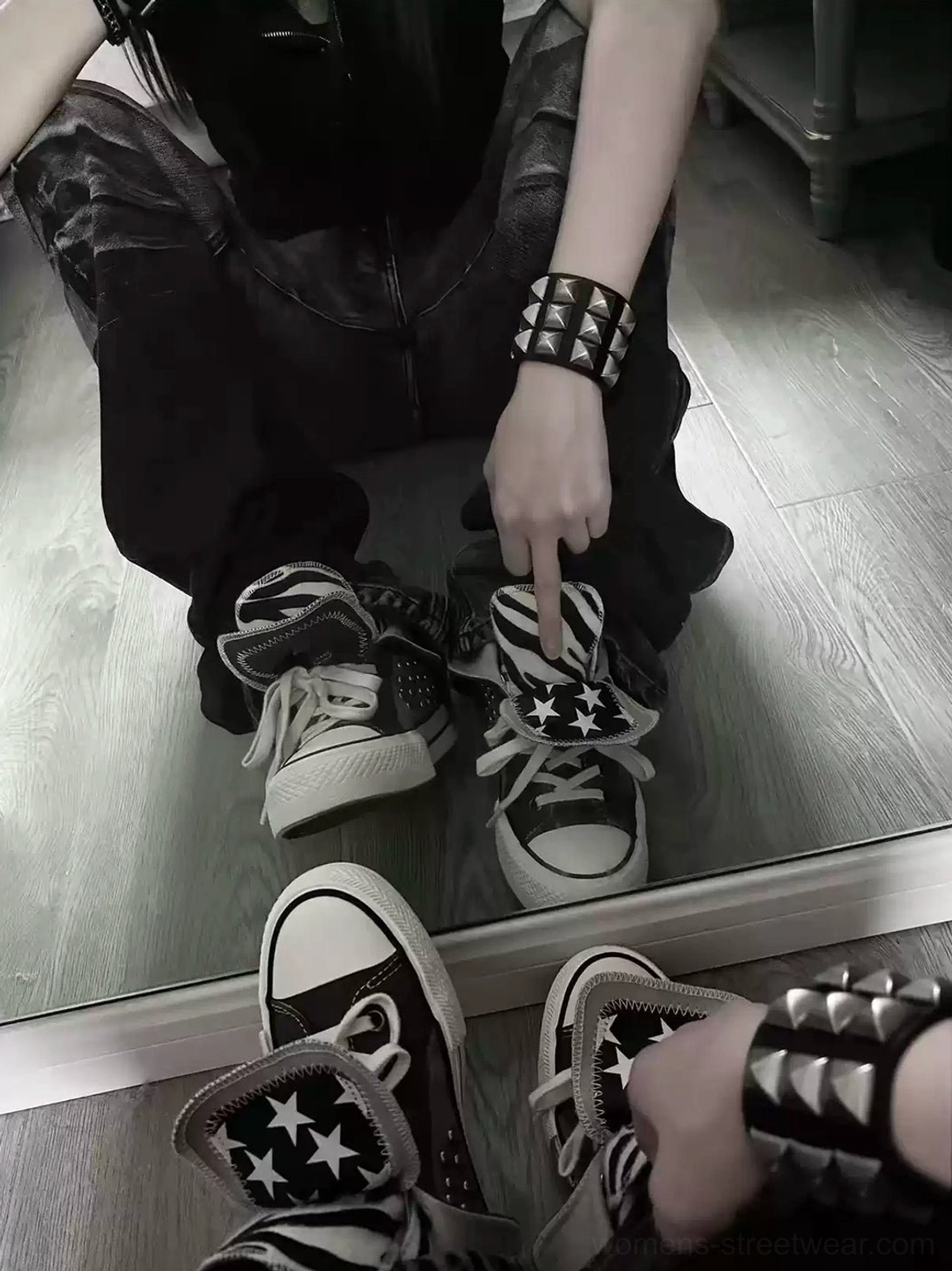 Mirror lifestyle view of punk outfit styled with star foldover collar rivet high-top canvas sneakers