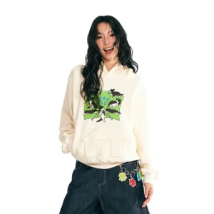 Beige Puppy House oversized graphic hoodie with cartoon puppy chest print and house-shaped kangaroo pocket styled with dark wide-leg jeans