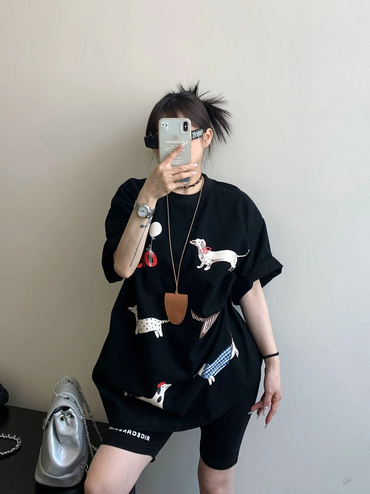 Black Puppy Parade oversized dachshund graphic T-shirt front view with cartoon dog print