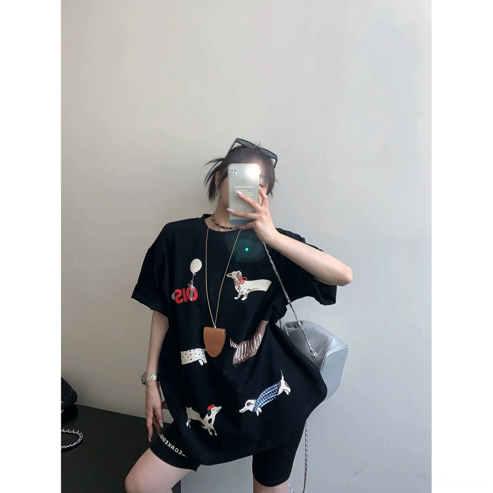Black Puppy Parade oversized dachshund graphic T-shirt styled with biker shorts for Korean streetwear