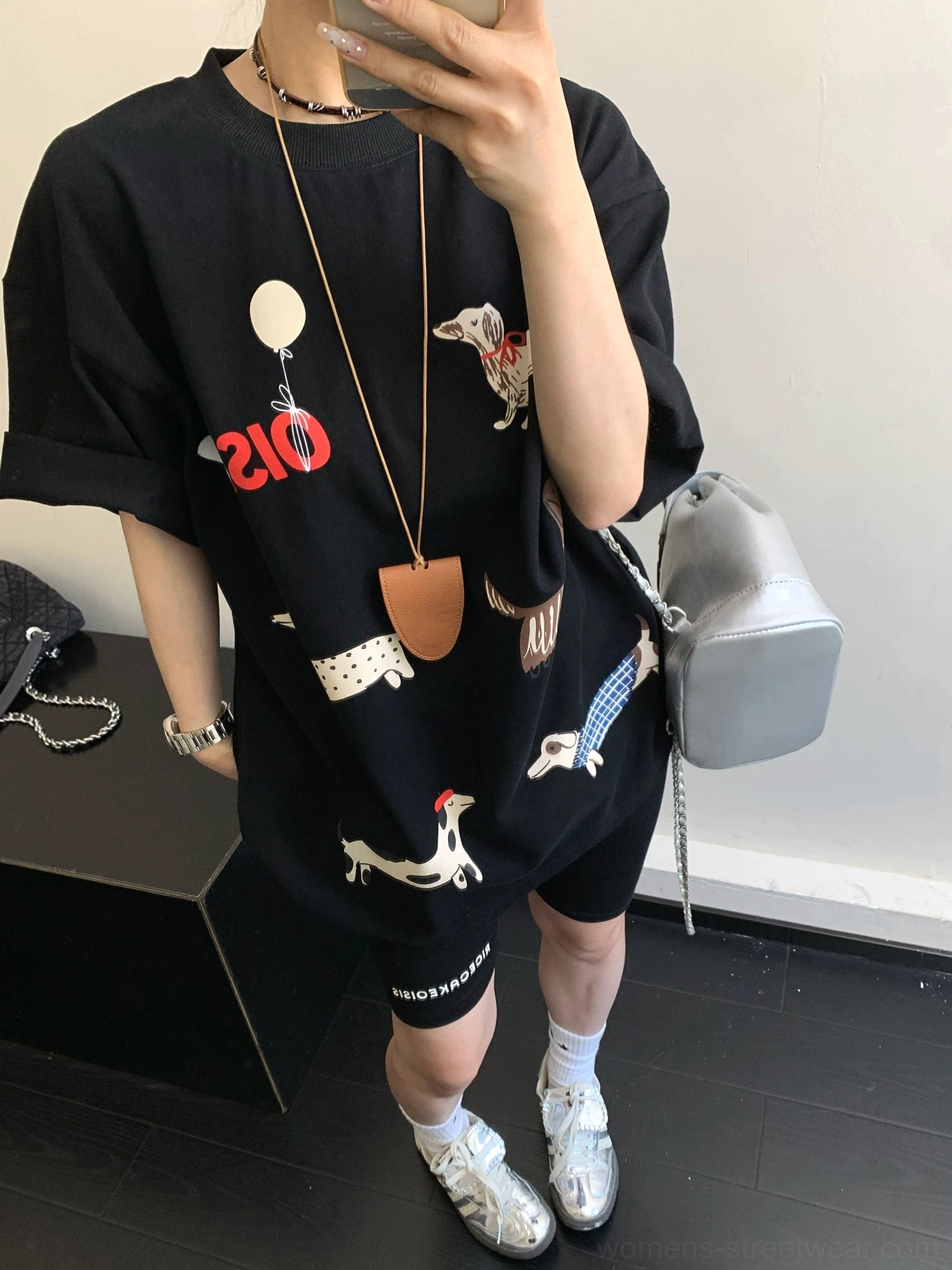 Black Puppy Parade oversized dachshund graphic T-shirt styled with biker shorts and crossbody bag