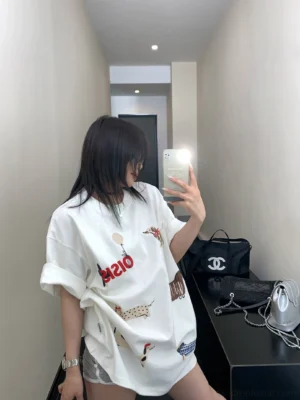 White Puppy Parade oversized dachshund graphic T-shirt side view showing loose streetwear fit