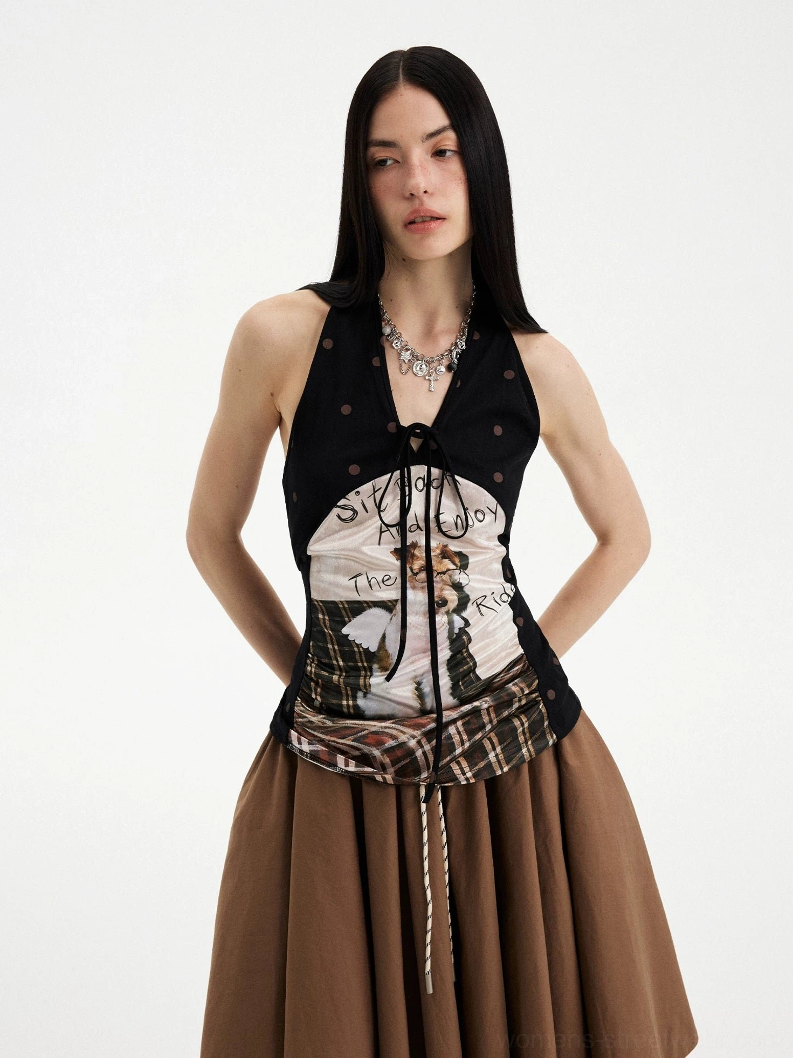 Medium full body view of a puppy print halter top with plaid waist panel and brown flared midi skirt outfit