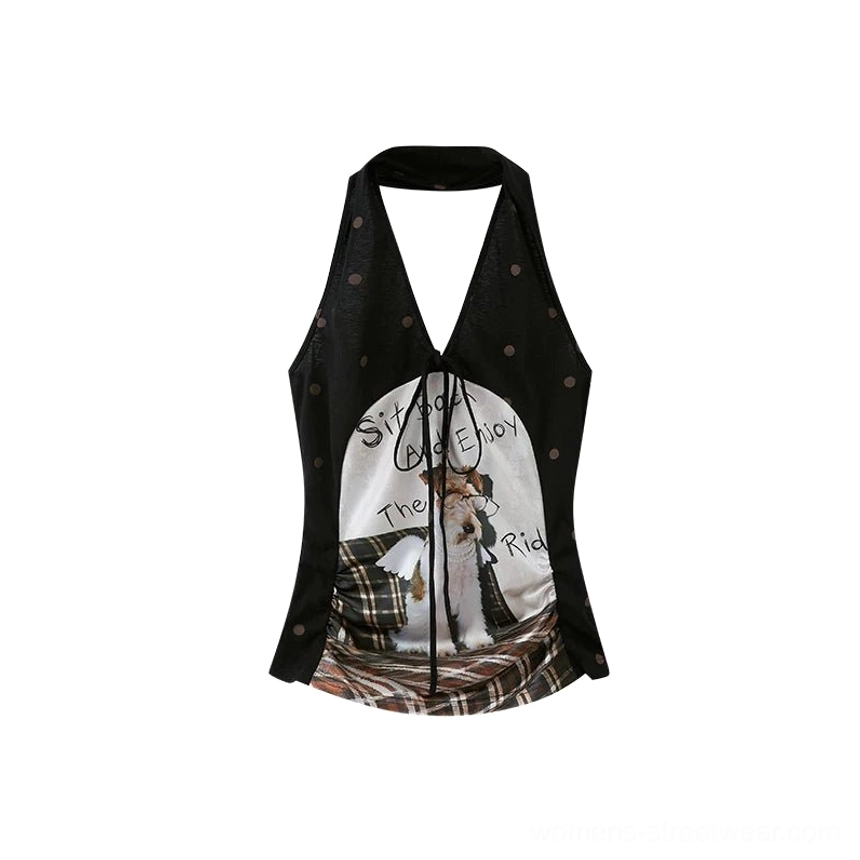 Flat lay front view of a puppy print plaid halter top with brown polka dots, tie-up neckline, graphic print, and plaid lower panel