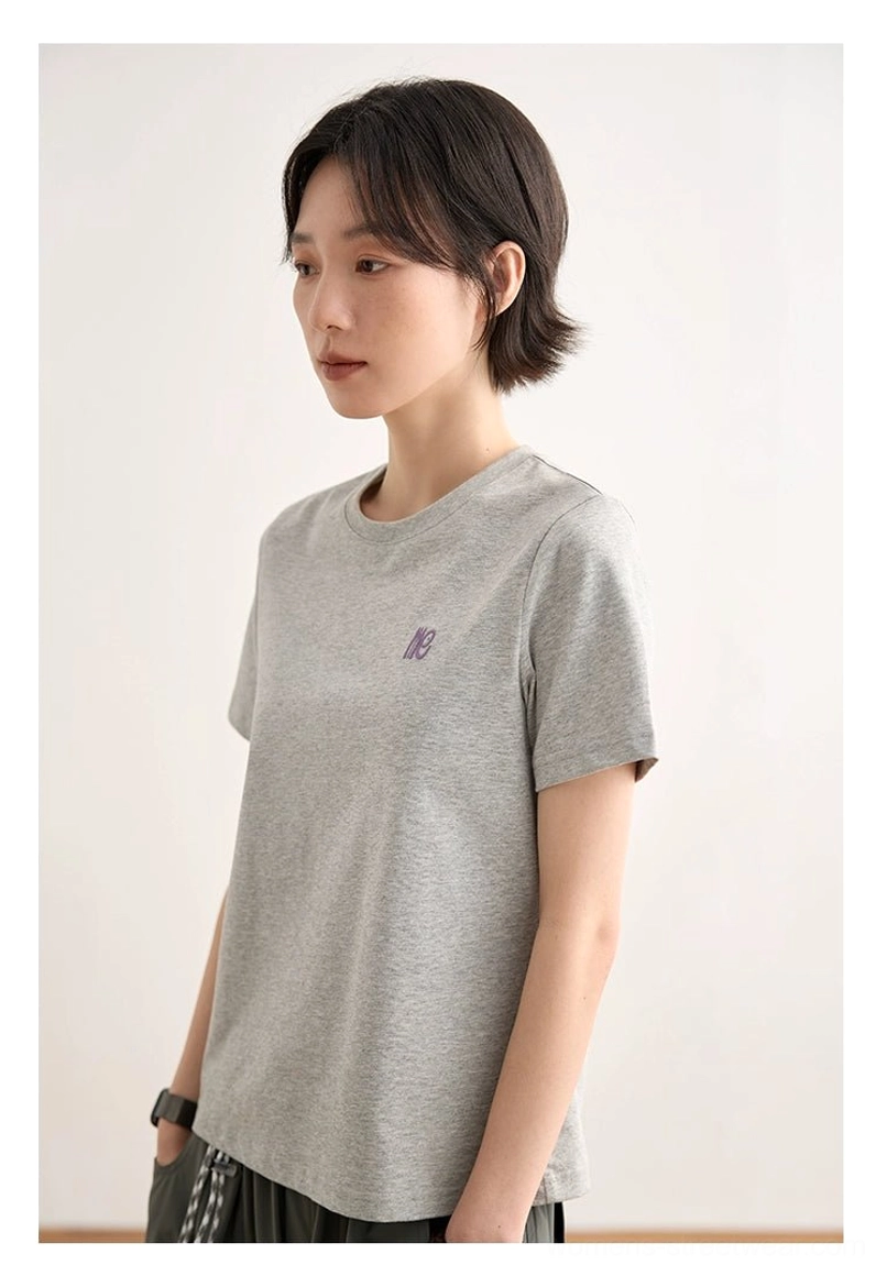 Pure black minimalist embroidered logo crew neck t-shirt side profile fit silhouette streetwear