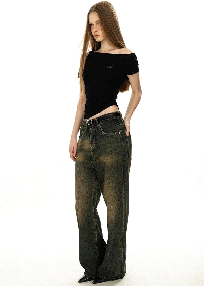 Pure black off-shoulder basic tee boat neckline worn solo with high-waisted cargo pants and minimal accessories streetwear