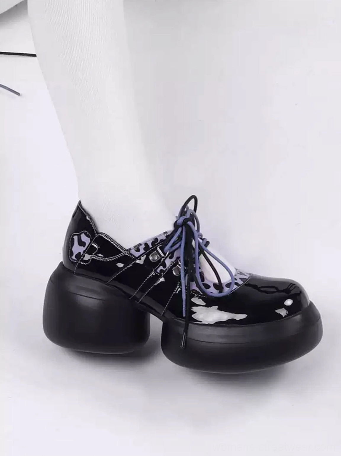 Single glossy black purple leopard lace-up platform Oxford shoe showing chunky sole and block heel
