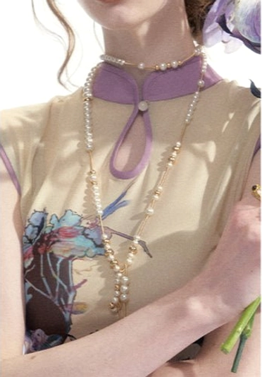 Close up of purple mandarin collar and keyhole neckline on a watercolor floral print mesh cheongsam dress