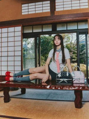 Quilted bow mini bowling handbag in pink and black colorways styled with Japanese-inspired preppy streetwear in a traditional room