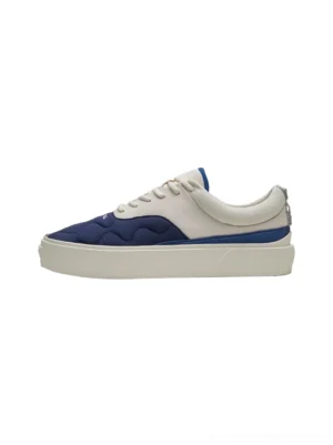 Navy blue and off-white quilted colorblock platform sneakers shown from an overhead side view