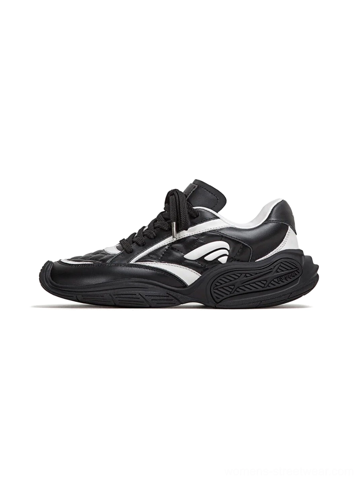 Black and white quilted leather low-profile sport sneakers shown from the left side on a clean studio background