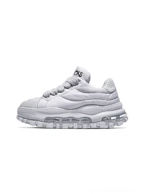 White quilted leather ripple sole trail runner sneaker shown in left side studio product view