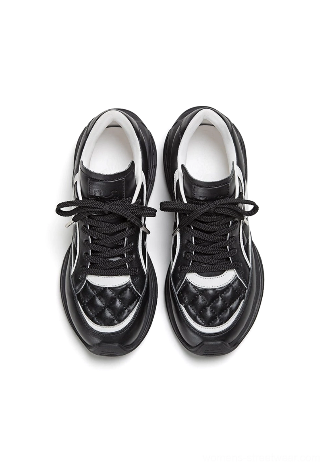Front view of quilted leather low-profile sneakers with flat laces quilted toe caps and white inner lining