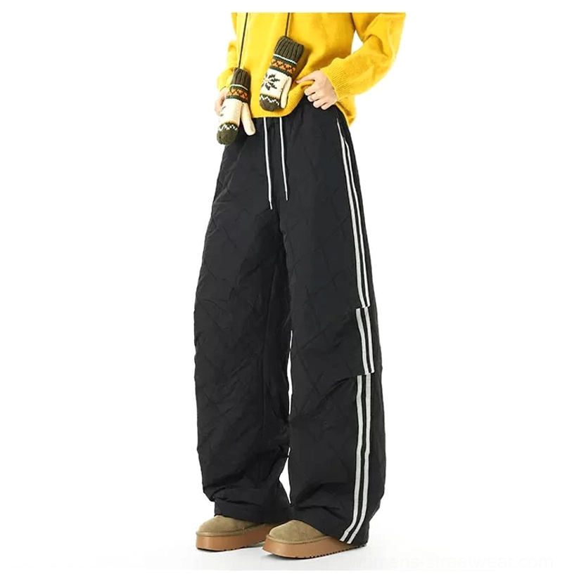 Quilted wide-leg track pants with contrast side stripes and padded diamond stitched winter streetwear design