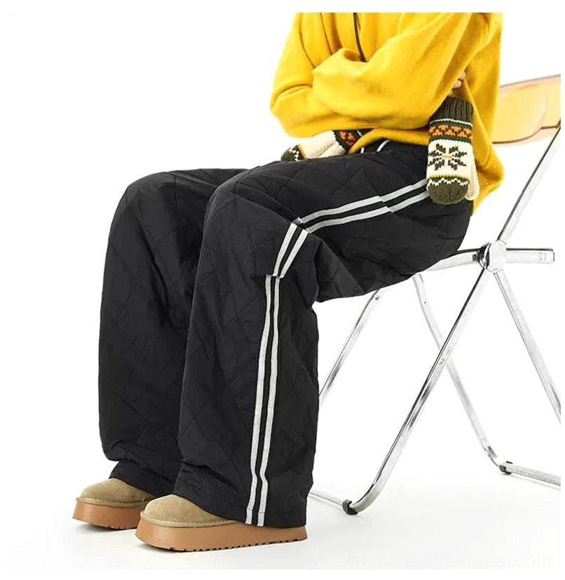 Relaxed quilted wide-leg track pants with double athletic side stripes for cold-weather streetwear styling