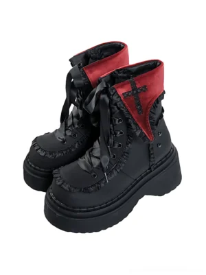 Pair of red and black cross platform combat boots displayed from the front with matching velvet collars, decorative laces, and chunky platform soles