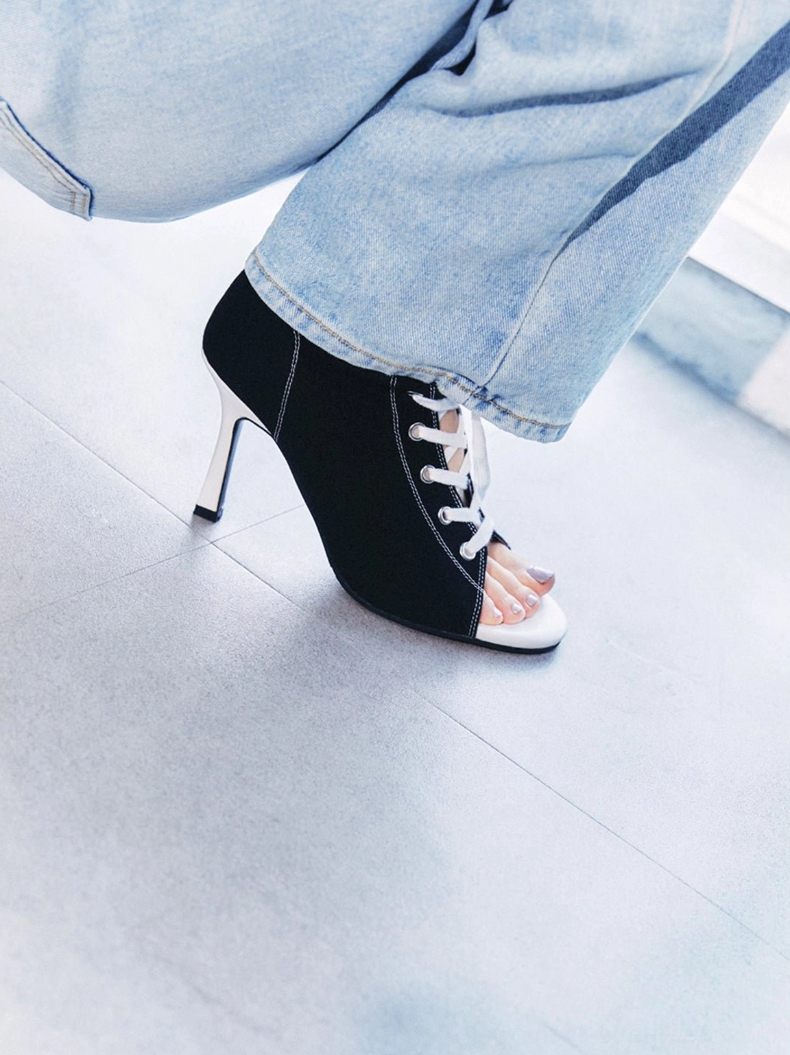 Women's red and black lace-up stiletto ankle boots with open toe design, contrast accents, zipper closure, and Y2K streetwear appeal