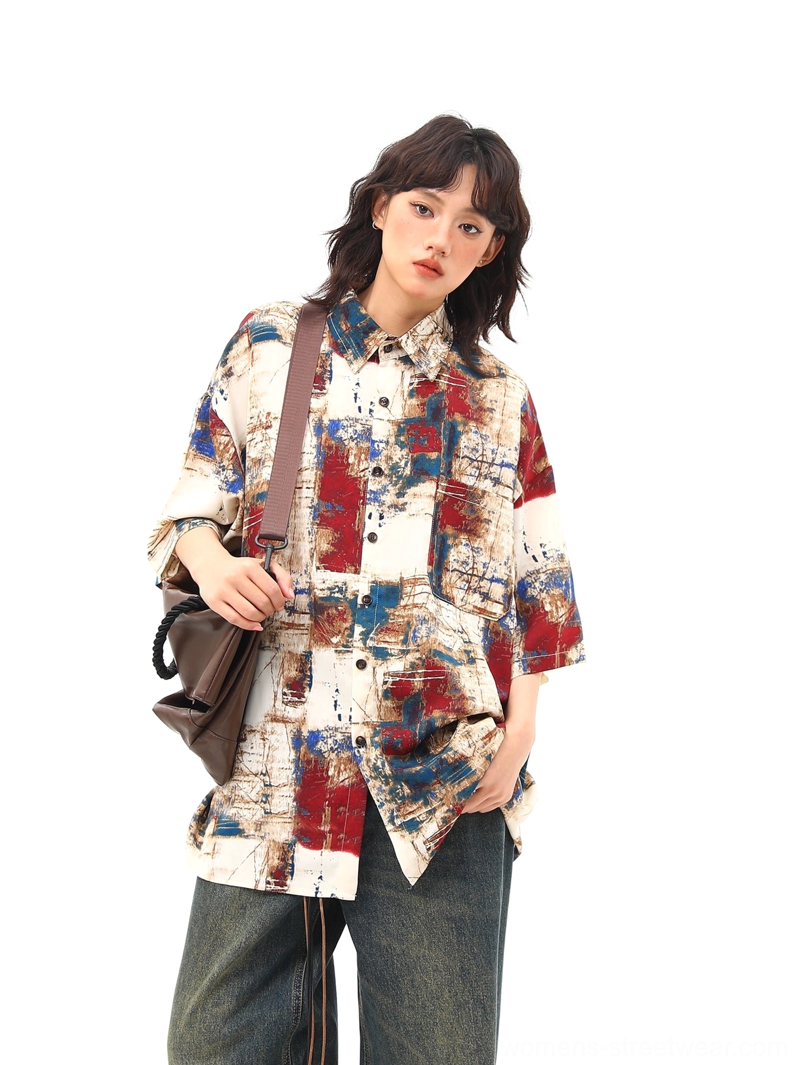 Red blue abstract print oversized streetwear shirt side three quarter view with wide leg denim styling