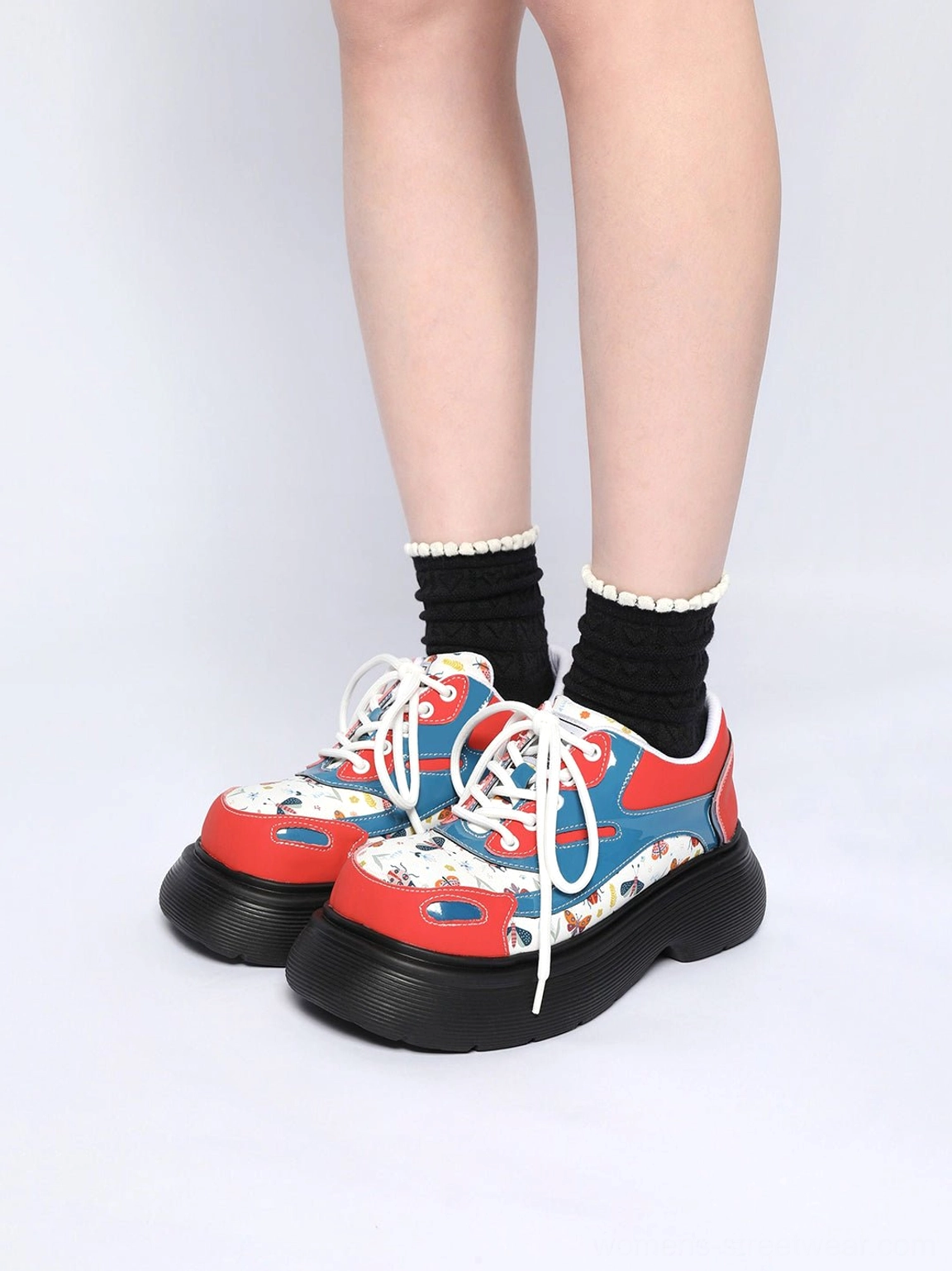 Front overhead view of red and blue butterfly print lace-up platform derby shoes with white laces