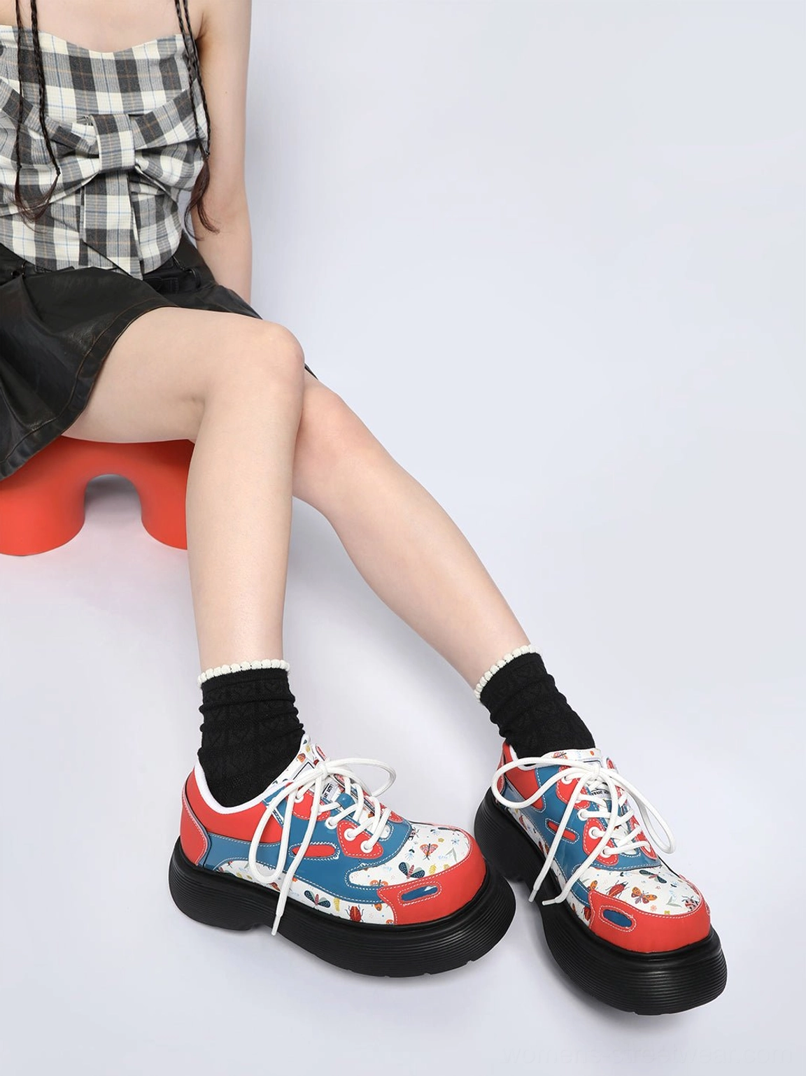 Red butterfly print platform lace-up derby shoes styled with a checked Y2K streetwear outfit