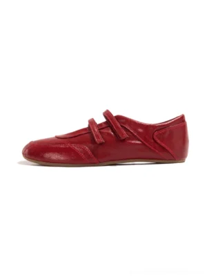 Red crisscross strap leather-look flats front view with rounded ballet-inspired toe and polished finish
