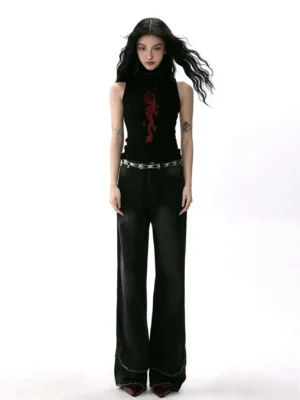 Full-body front view of black fitted sleeveless turtleneck top with red dragon print styled with frayed wide-leg jeans