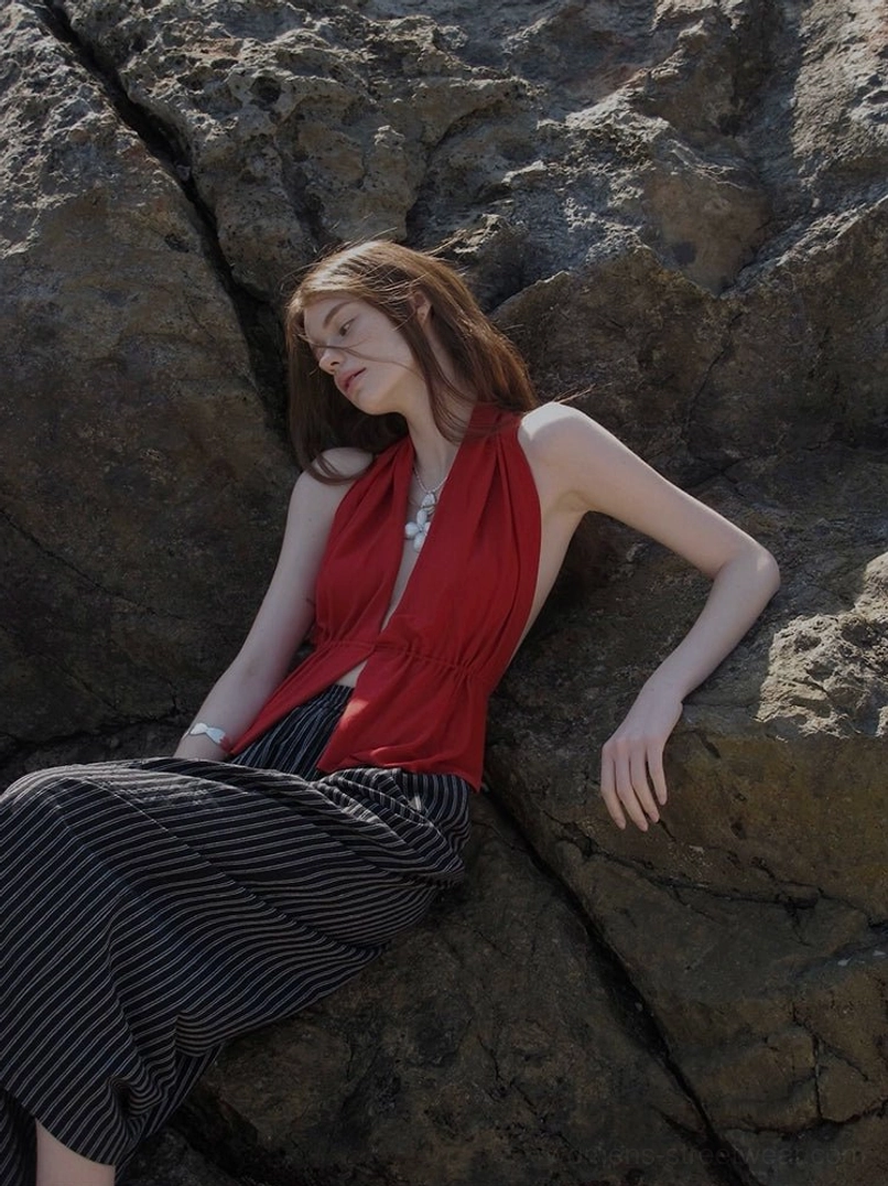 Red fitted halter neck keyhole top with softly draped fabric in a relaxed coastal streetwear outfit