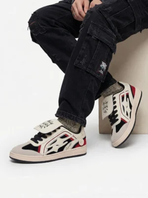 Red flame panel retro skate sneakers worn with black cargo pants and gray socks in a streetwear outfit