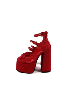 Red floral lace bow platform block heel sandals in side three-quarter view with layered ankle straps and chunky heel