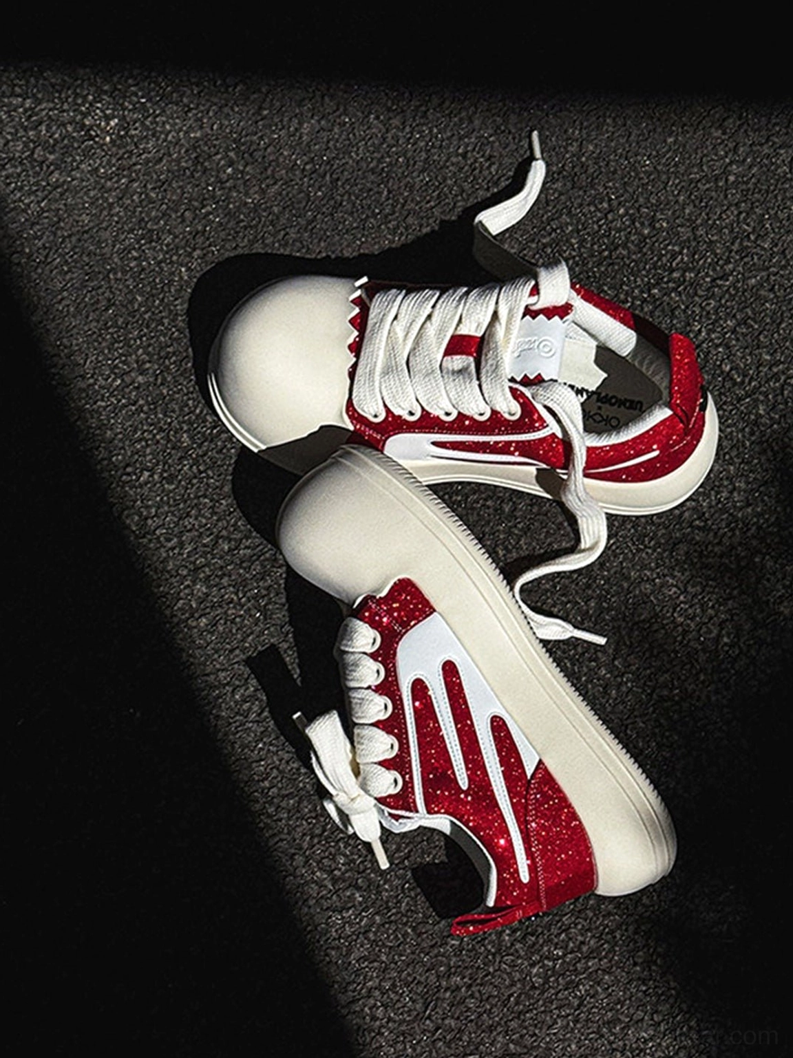 Top view of red glitter chunky platform sneakers with white round toe caps, contrast side stripes and thick white soles